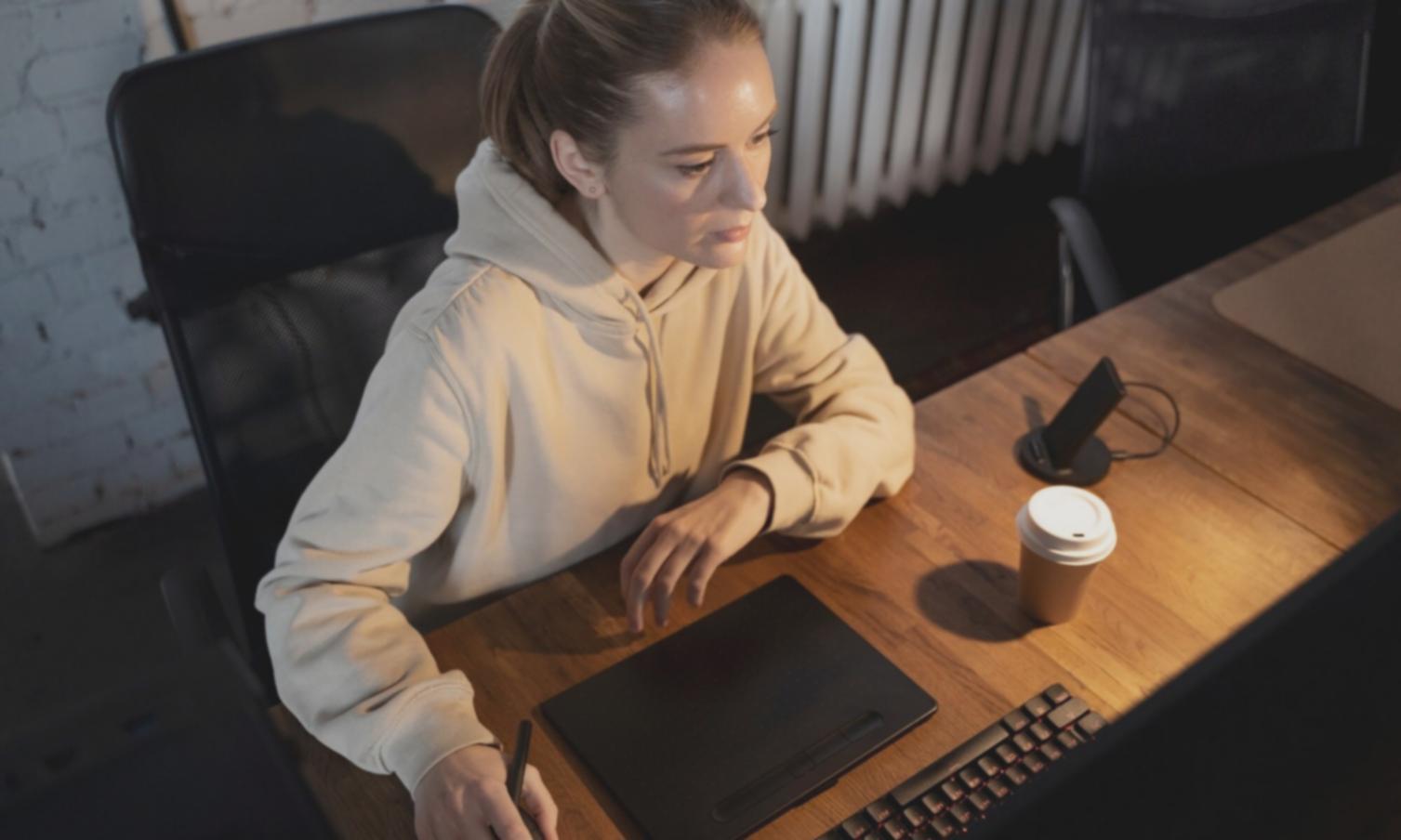 Person reviewing financial documents with a calm, organized approach